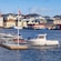 Boats on the water next to the Norwegian flag in Haugesund in Norway